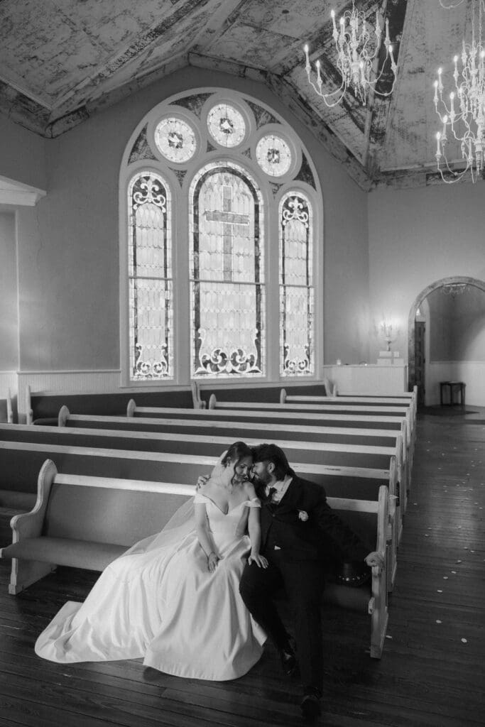 Bride and groom cuddling at The 1906 Venue in Whitesboro during wedding photography