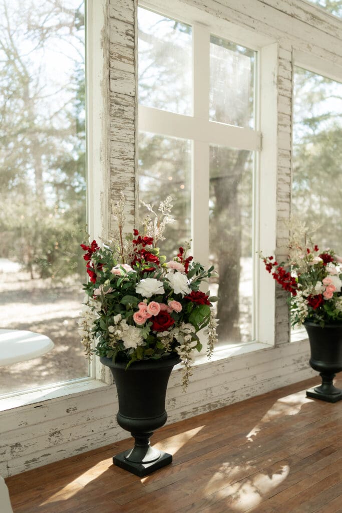 Florals at the altar at Soli Deo Gloria Weddings and Events in Decatur, TX