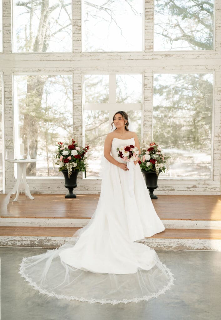 Bride posing at the altar at Soli Deo Gloria Weddings and Events in Decatur, TX