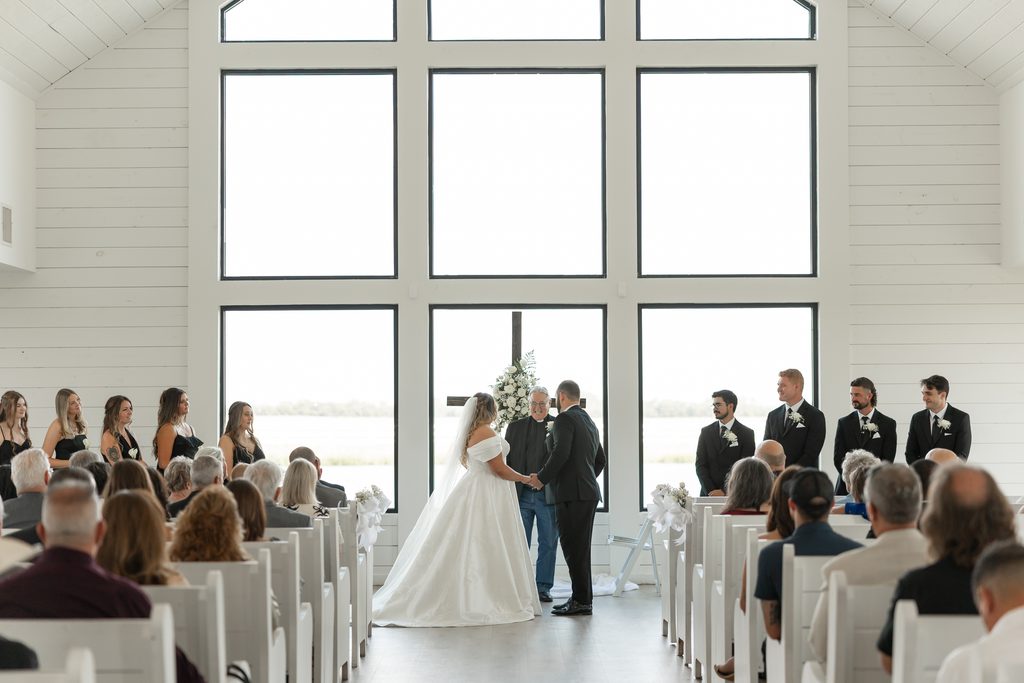 Bride and groom at altar at The Gardenia wedding venue, one of the best wedding venues in Dallas Fort Worth