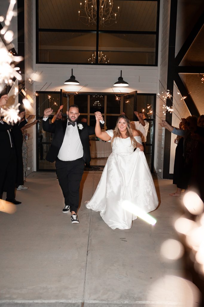 Bride and groom wedding exit at The Gardenia wedding venue, one of the best wedding venues in Dallas Fort Worth