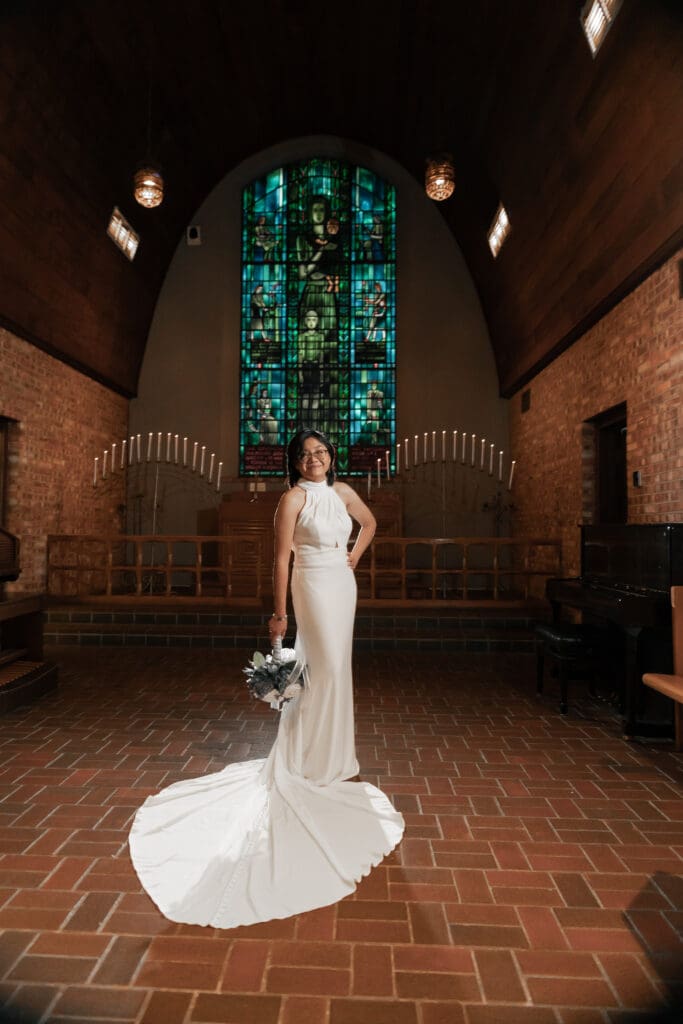 Creative low-light wedding portrait of couple with off-camera flash at Little Chapel in the Woods