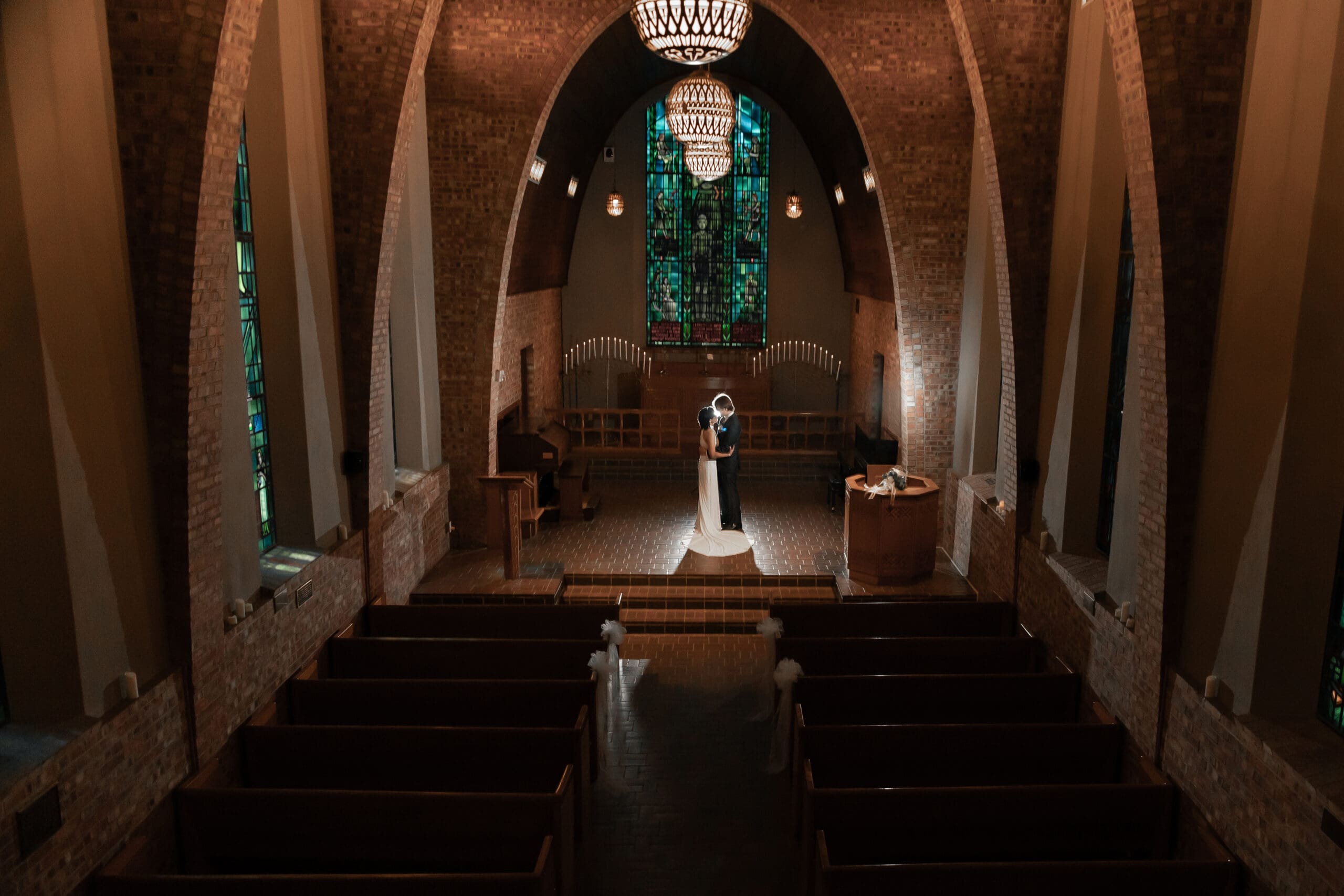 Wedding portrait at Little Chapel in the woods in low-light