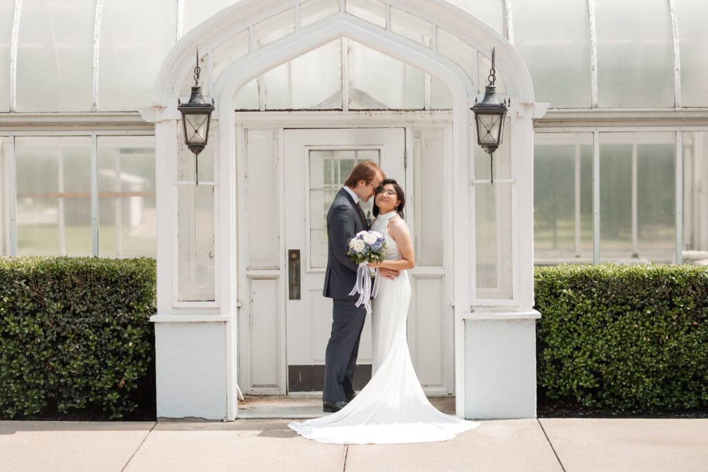 Creative wedding portrait of couple at Little Chapel in the Woods