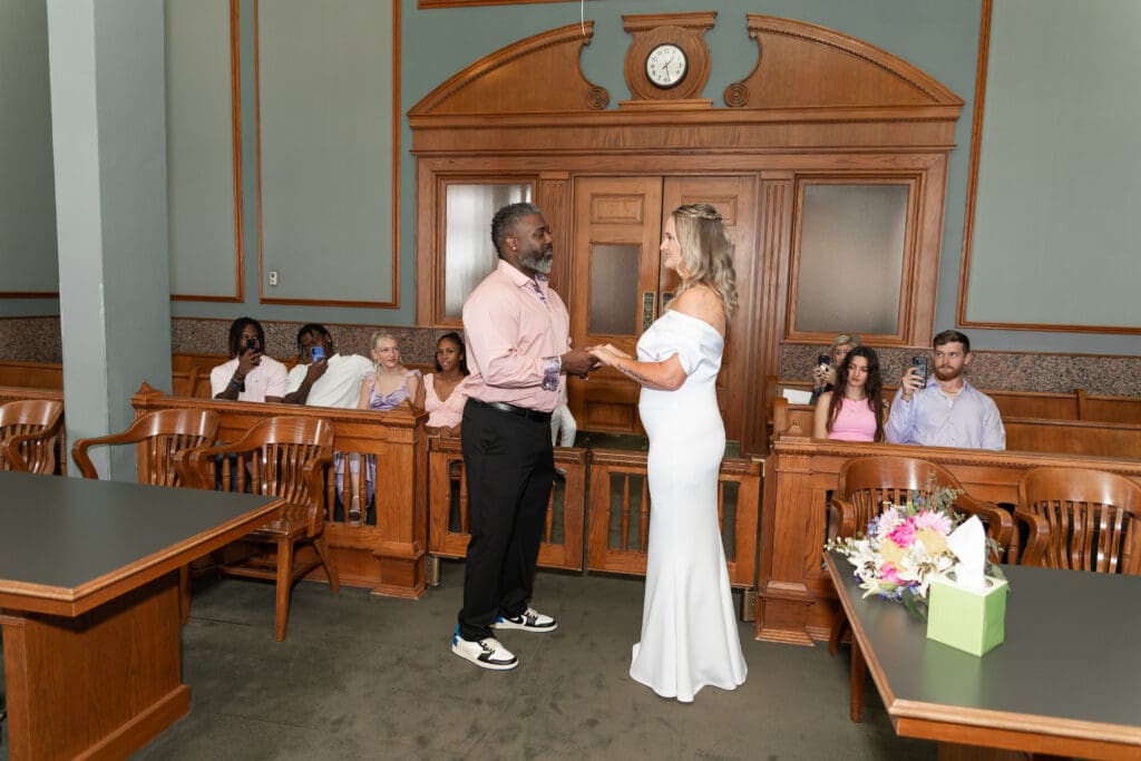 Bride and groom reading their vows to each other during their intimate Fort Worth courthouse wedding.