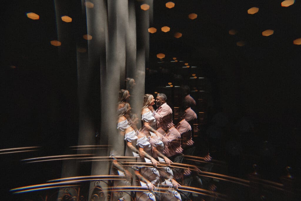 Bride and Groom kissing under skylight in Tarrant County Courthouse
