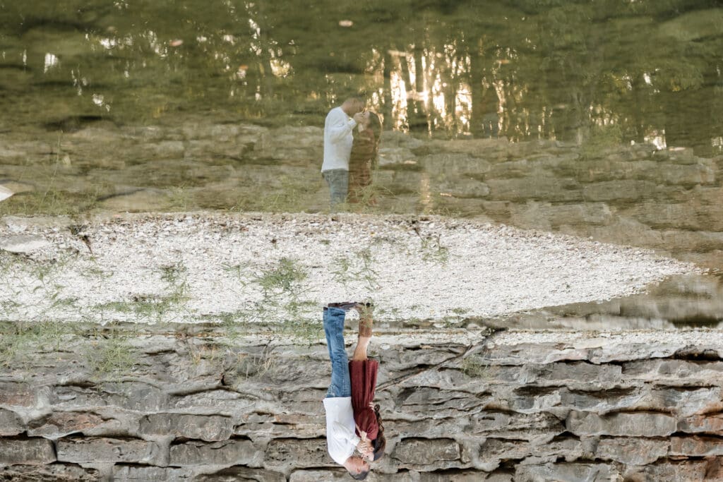 Engaged couple at Airfield Falls Park, Fort Worth, enjoying golden-hour engagement photos