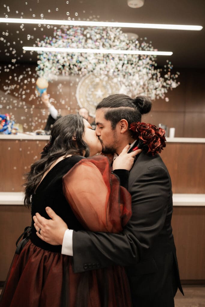 Judge Adam Swartz celebrating Esmeralda and Hector’s Dallas courthouse wedding with bubbles