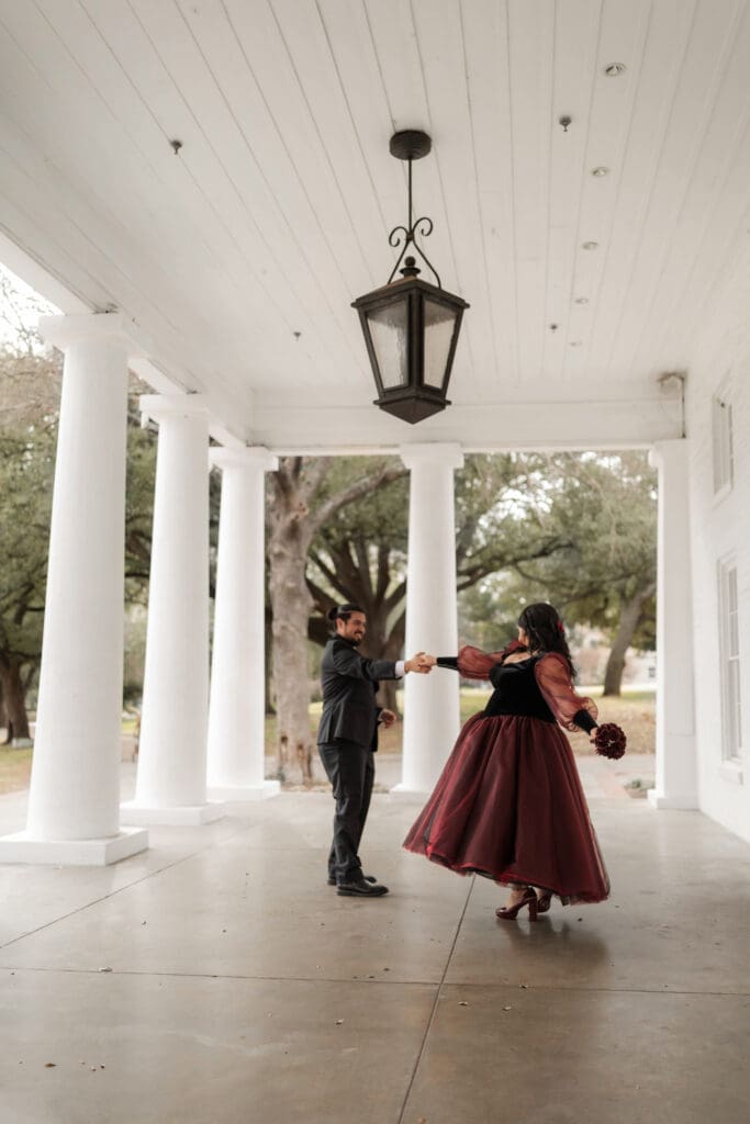 Esmeralda and Hector in front of Arlington Hall at Turtle Creek Park during their Dallas courthouse wedding