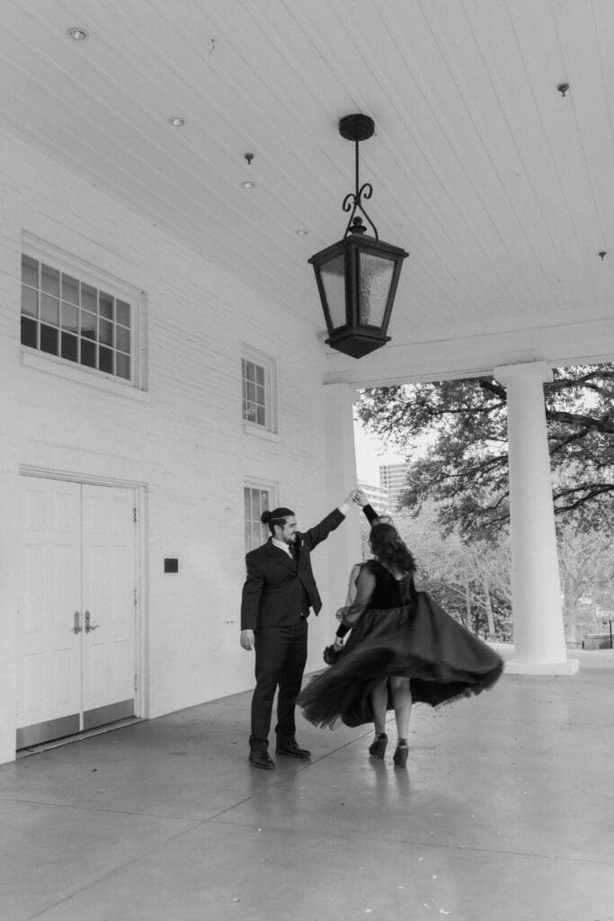 Esmeralda and Hector in front of Arlington Hall at Turtle Creek Park during their Dallas courthouse wedding