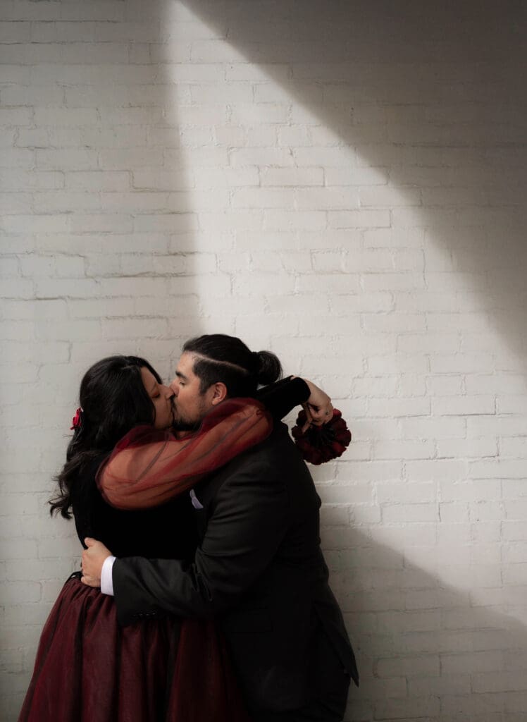 Esmeralda and Hector in front of Arlington Hall at Turtle Creek Park during their Dallas courthouse wedding