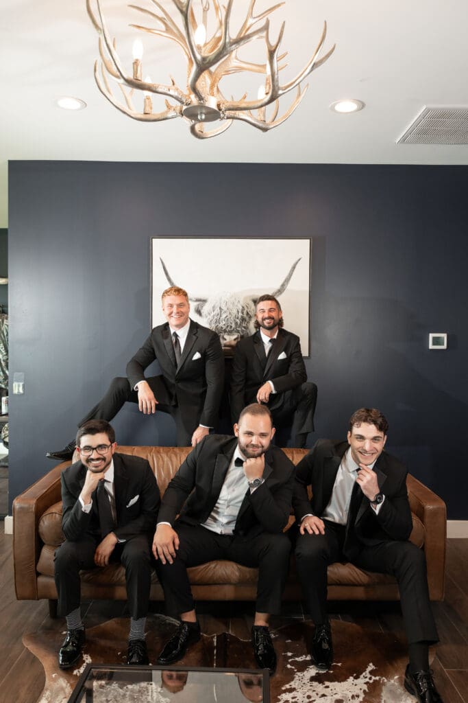 Groom's portraits with wedding party at The Gardenia Venue in Valley View, TX