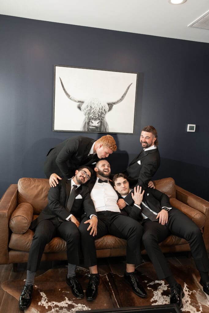 Groom's portraits with wedding party at The Gardenia Venue in Valley View, TX