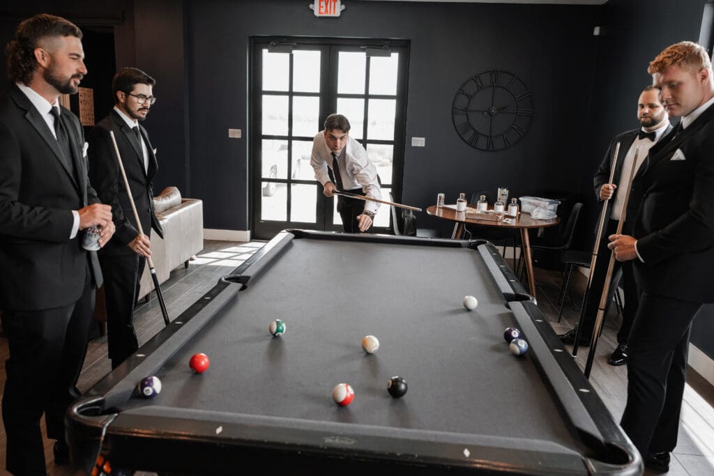 Groom's portraits with wedding party at The Gardenia Venue in Valley View, TX