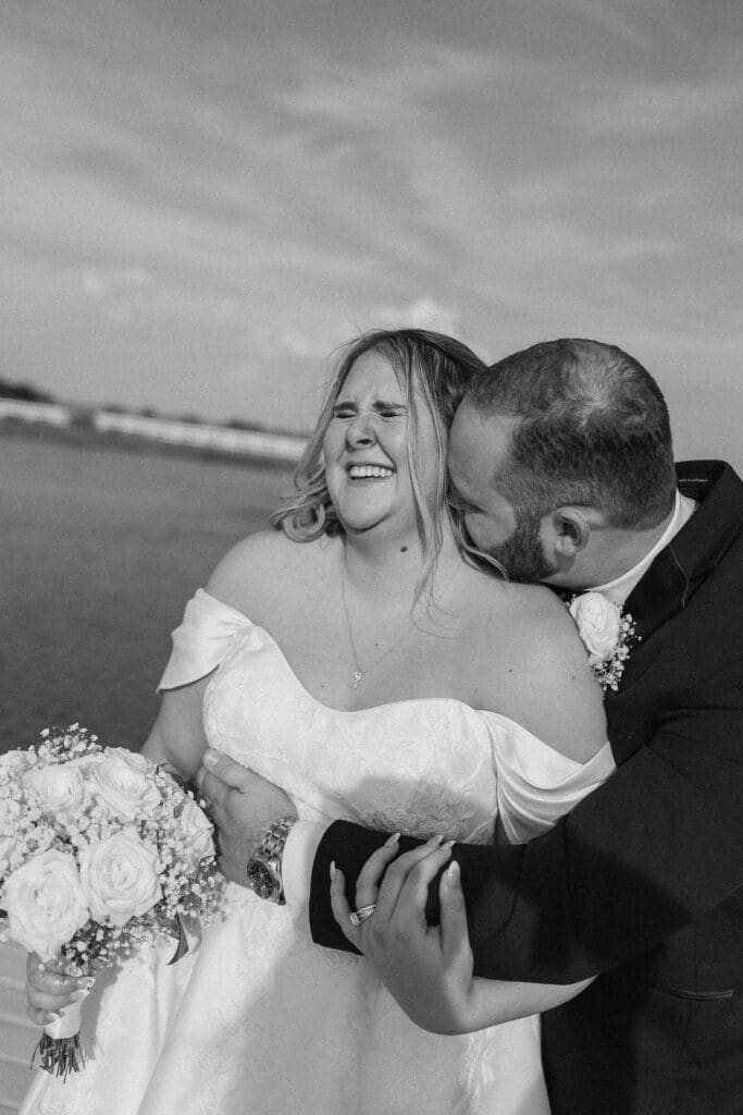 Bride and groom portraits along the pond at The Gardenia Venue in Valley View, TX