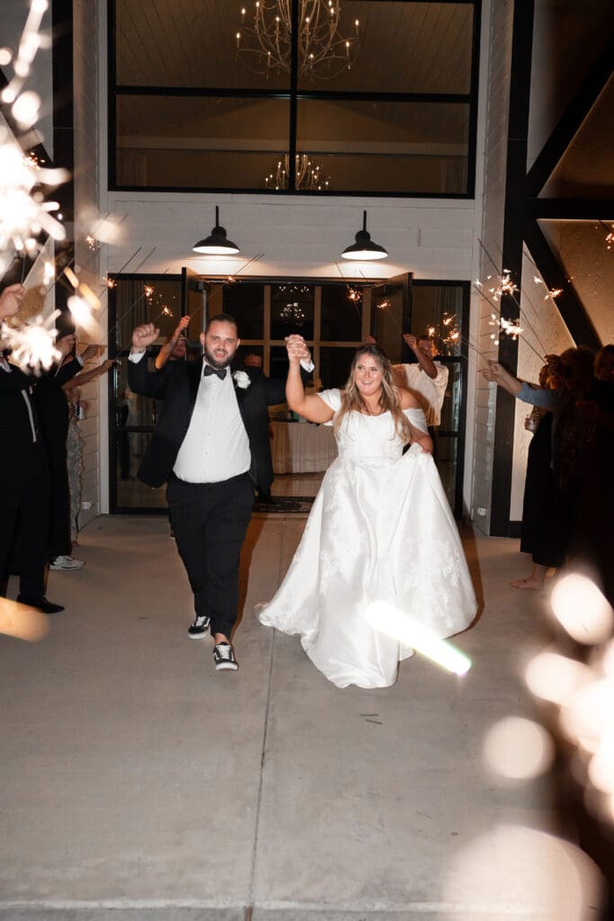 Bride and groom's grand exit with sparklers at The Gardenia Venue in Valley View, TX