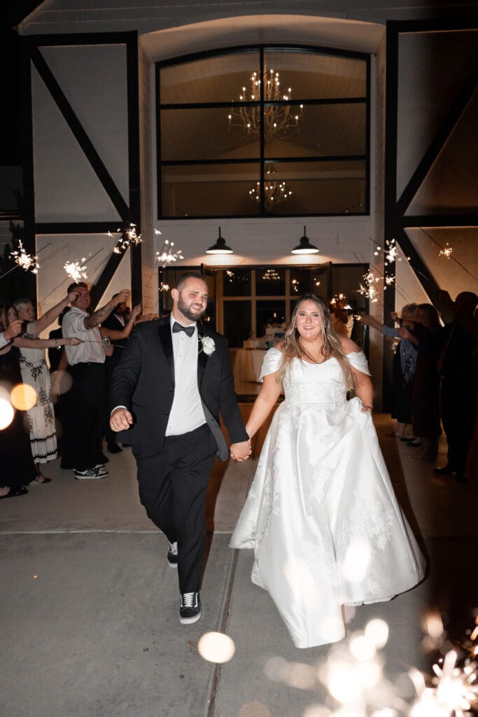 Bride and groom's grand exit with sparklers at The Gardenia Venue in Valley View, TX