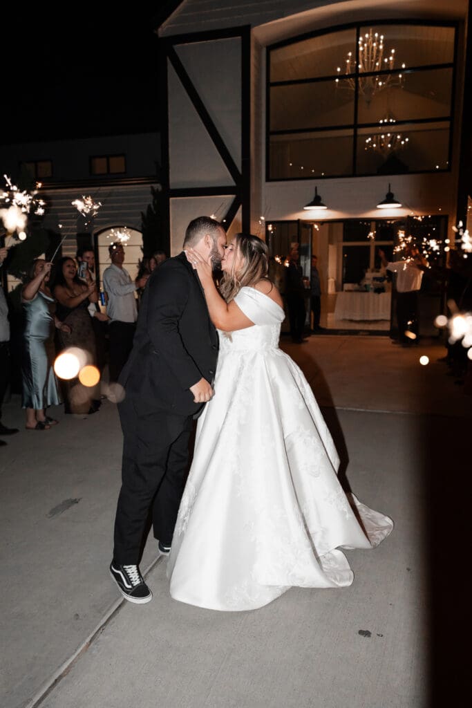 Bride and groom's grand exit with sparklers at The Gardenia Venue in Valley View, TX