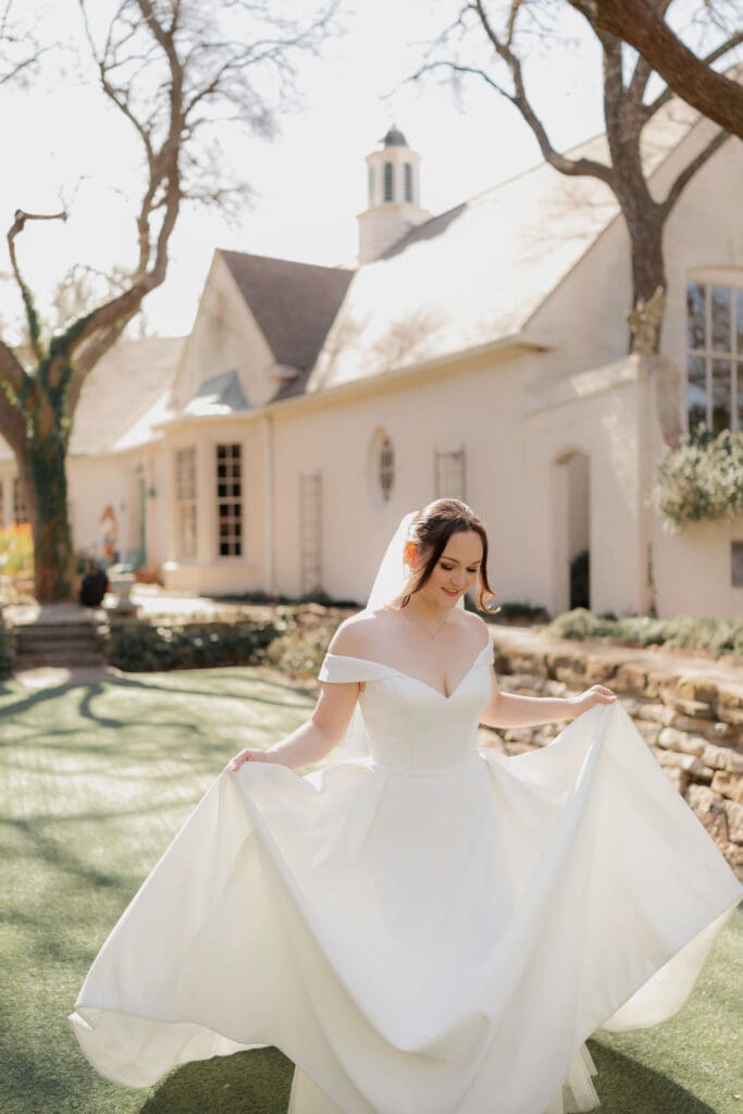 Bride running across lawn at Chandor Gardens in Weatherford, TX
