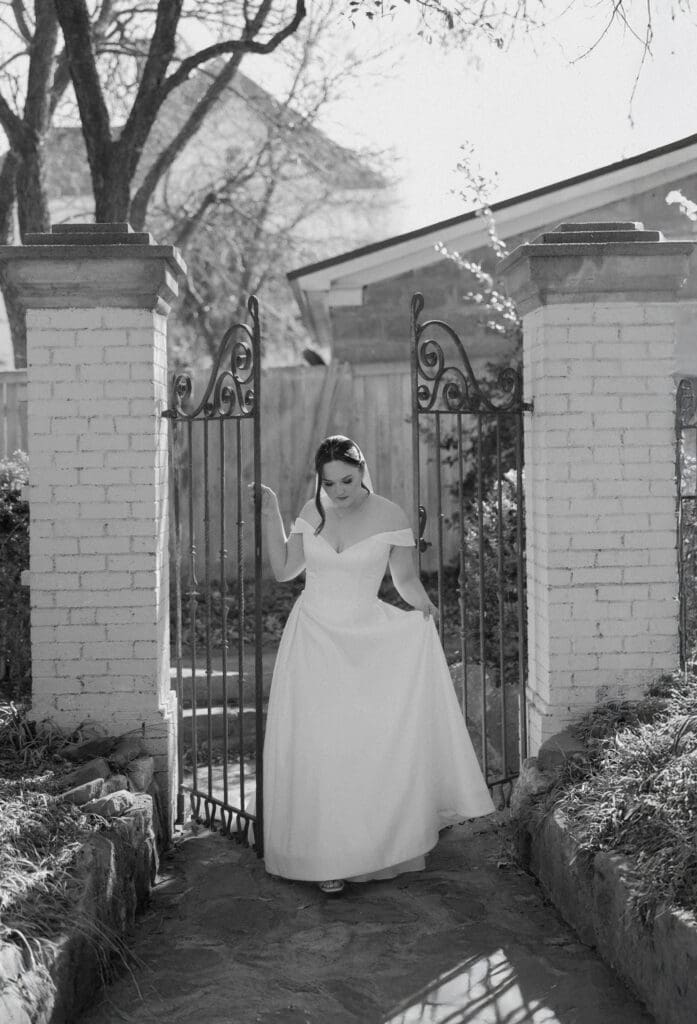 Bride walking through gate 