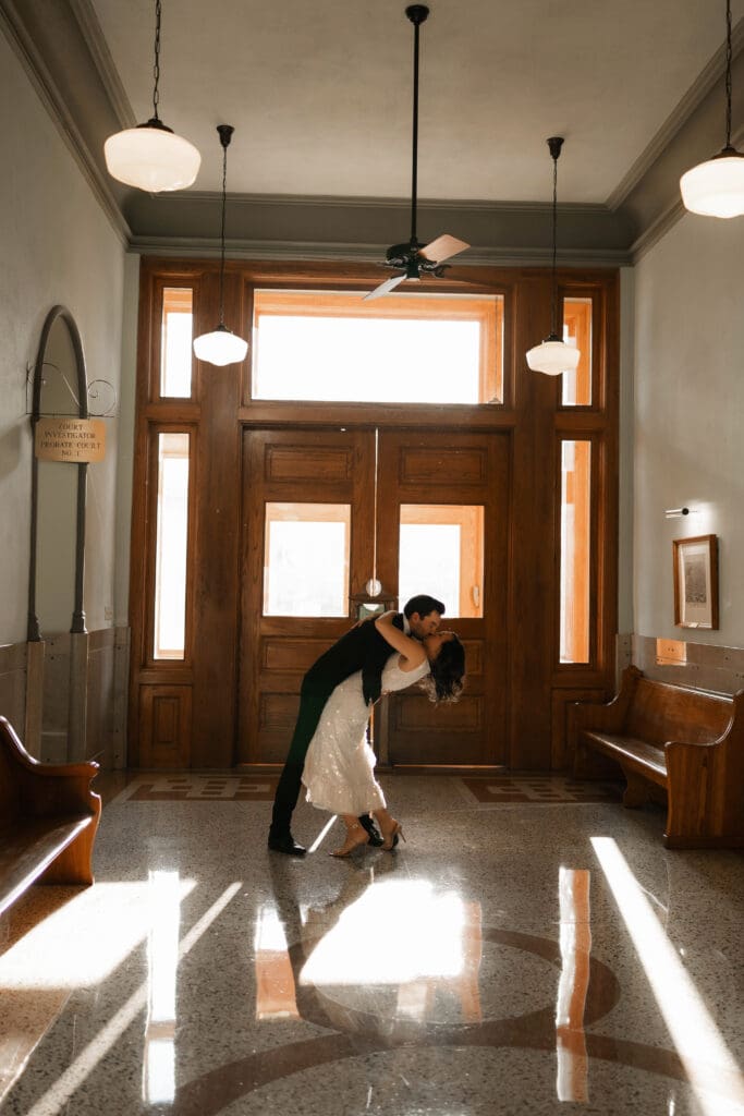 Woman and man cuddling on in the Fort Worth courthouse 