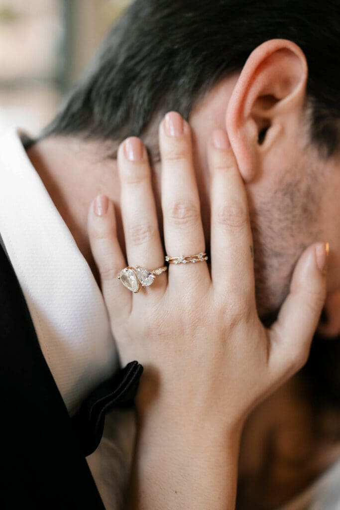 Woman and man cuddling inside the Sundance Square Pavilion greenhouse during their photo session