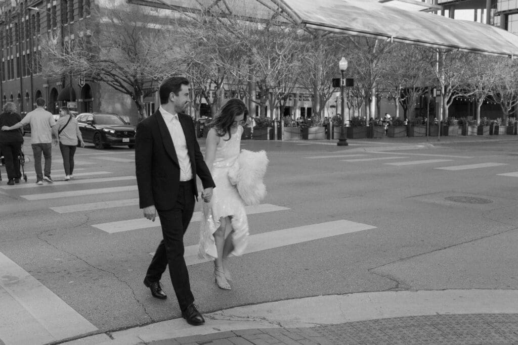 Woman and man crossing the street in downtown Fort Worth