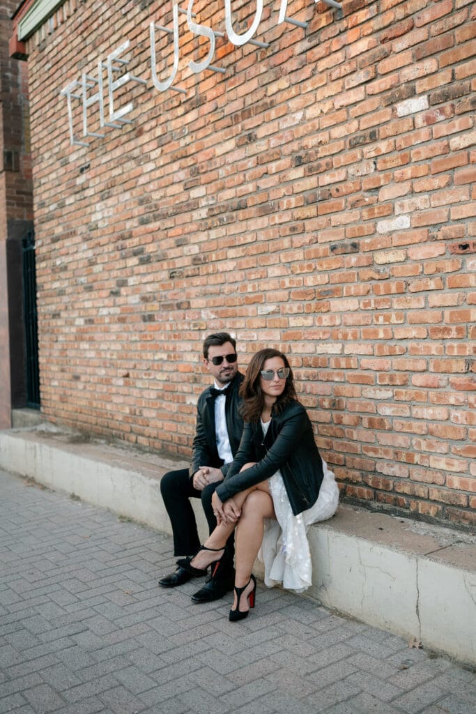 Woman and man cuddling outside the The Usual bar in Fort Worth