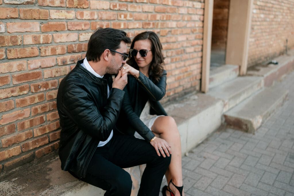 Woman and man cuddling outside the The Usual bar in Fort Worth