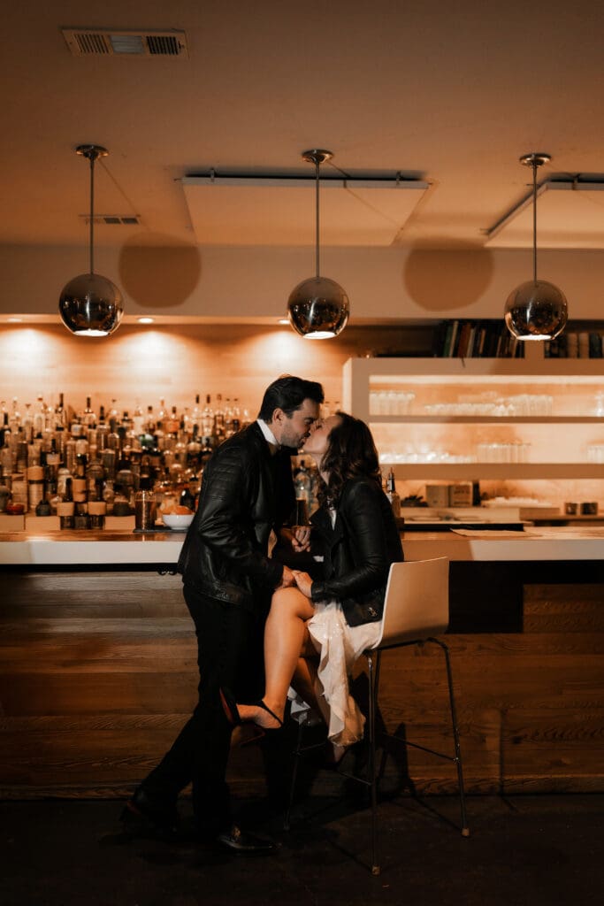 Woman and man cuddling at the bar in Fort Worth