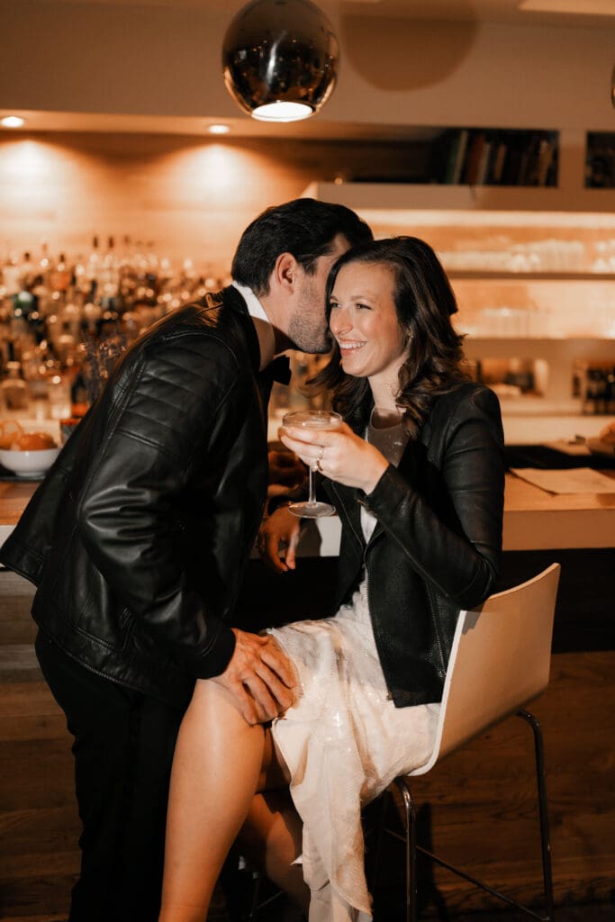 Woman and man cuddling at the bar in Fort Worth