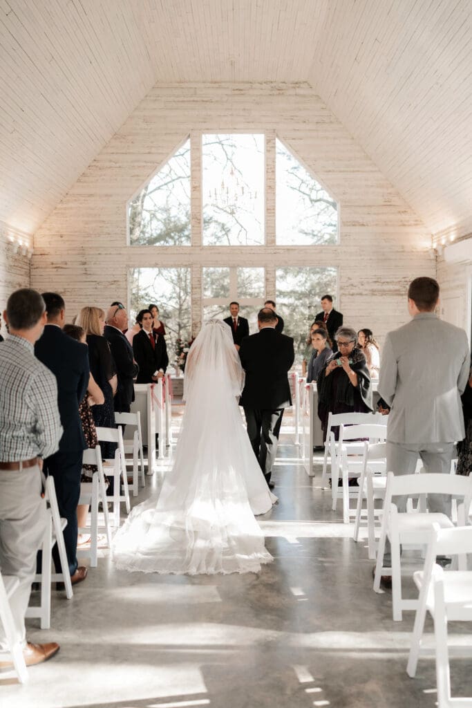 Bride and father walking do the aisle in the chapel at Soli Deo Gloria