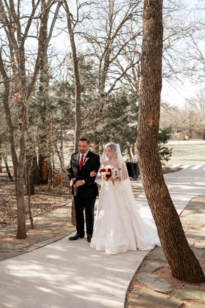 Bride and her father waiting to walk down the aisle