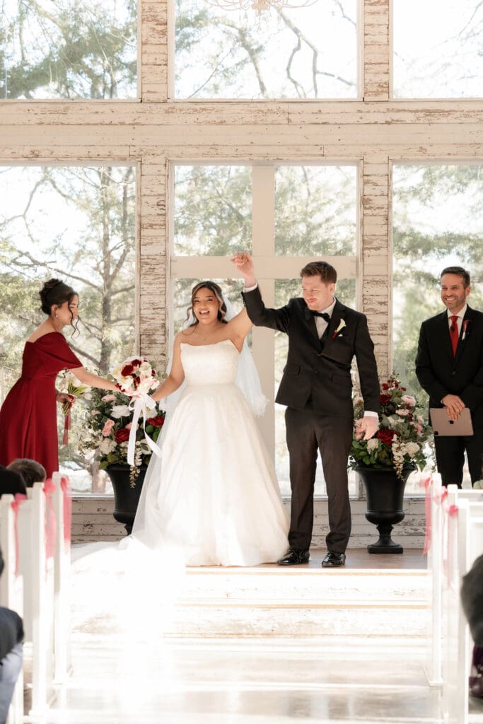 Bride and groom at altar in the little white chapel at Soli Deo Gloria weddings and events in Decatur