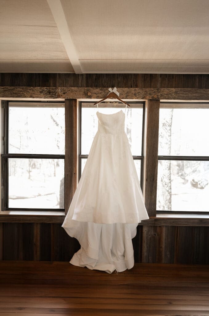 Wedding dress hanging from window