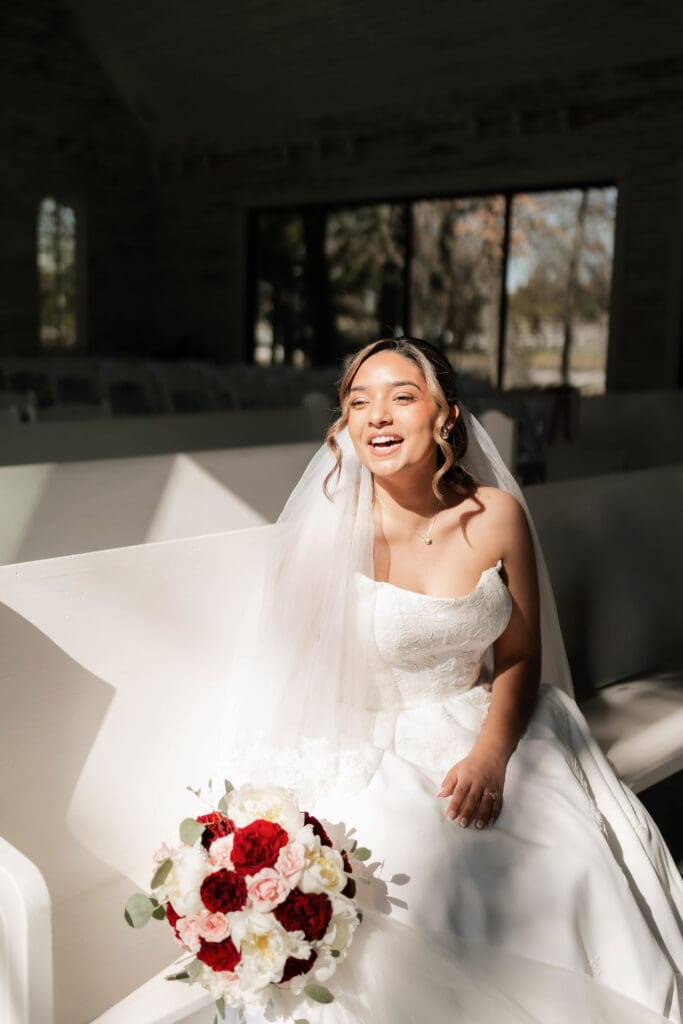 Moody bridal portraits of the bride in the chapel at Soli Deo Gloria with harsh direct light