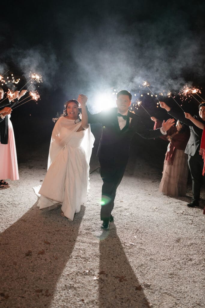 Bride and groom's grand exit with sparklers outside the reception hall at Soli Deo Gloria in Decatur
