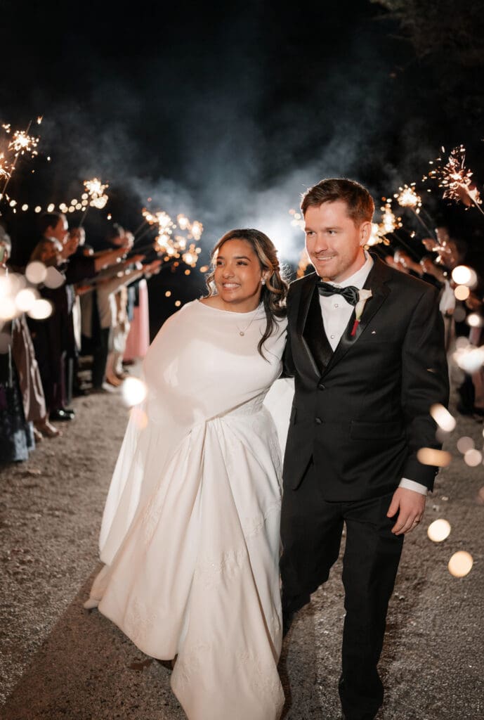 Bride and groom's grand exit with sparklers outside the reception hall at Soli Deo Gloria in Decatur