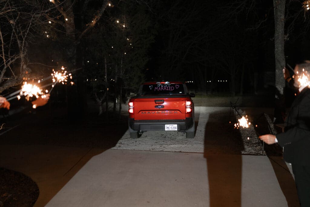 Bride and groom's grand exit with sparklers outside the reception hall at Soli Deo Gloria in Decatur