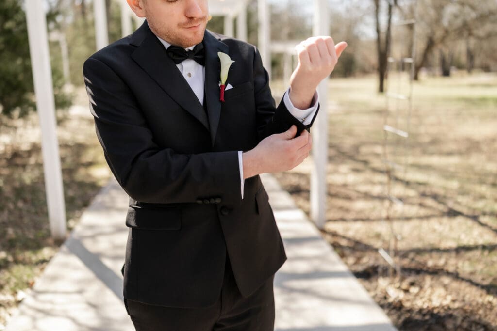 Portrait of the groom under the pergola hallway at Soli Deo Gloria Weddings and Events in Decatur
