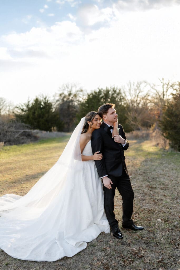 Bride and groom taking golden hour portraits outside at Soli Deo Gloria in Decatur