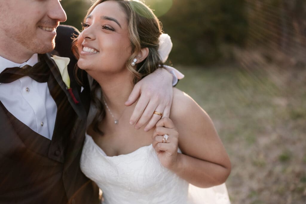 Bride and groom laughing while taking golden hour portraits outside at Soli Deo Gloria in Decatur