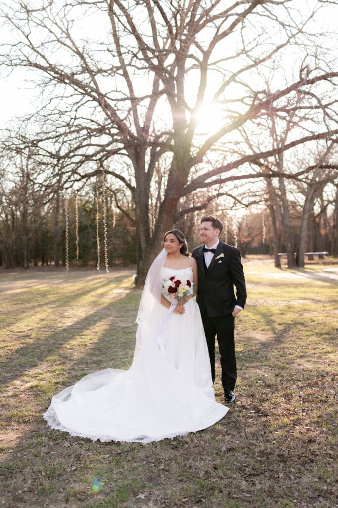Wedding photography of bride and groom outside with the sun setting behind them in Decatur, TX