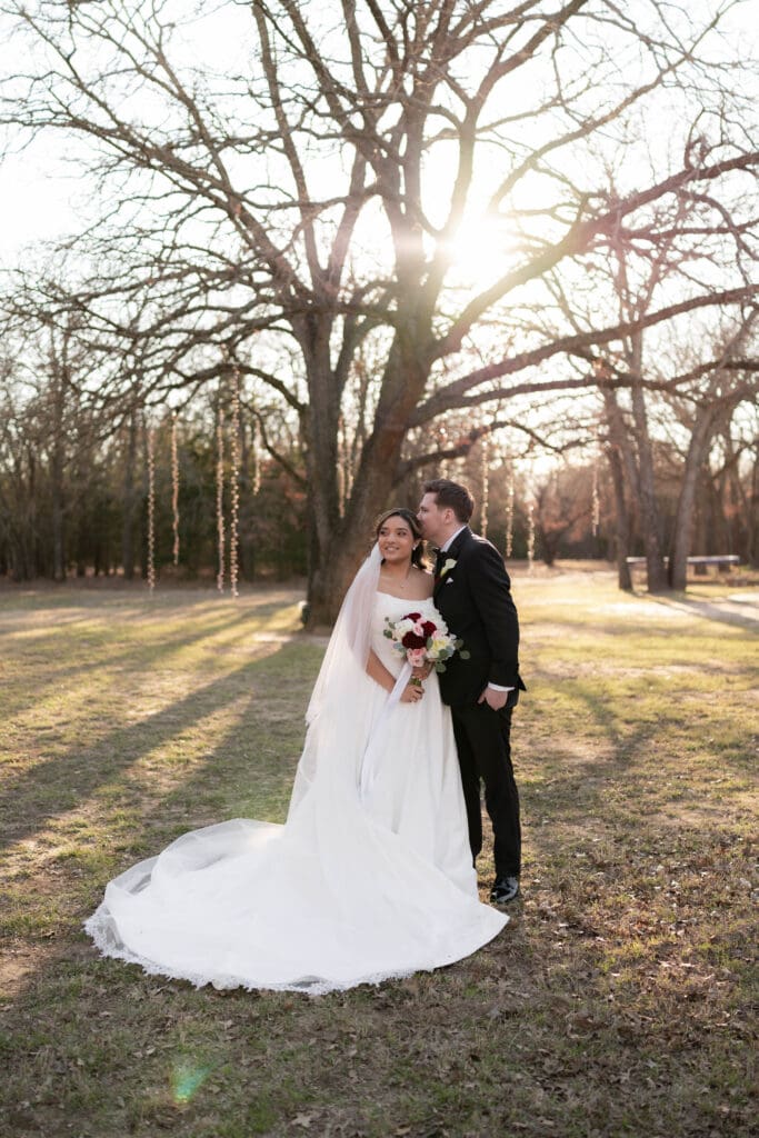 Wedding photography of bride and groom outside with the sun setting behind them in Decatur, TX