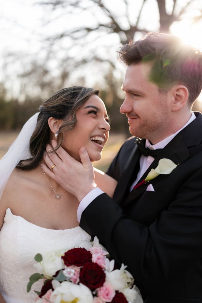 Wedding photography of bride and groom outside with the sun setting behind them in Decatur, TX