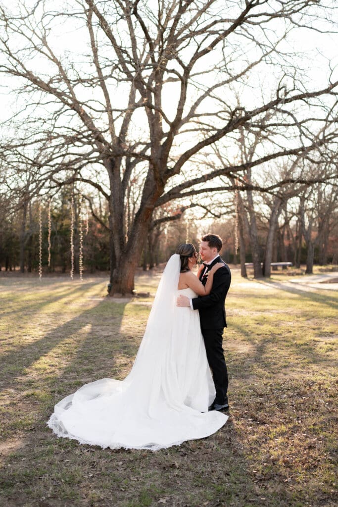 Wedding photography of bride and groom outside with the sun setting behind them in Decatur, TX