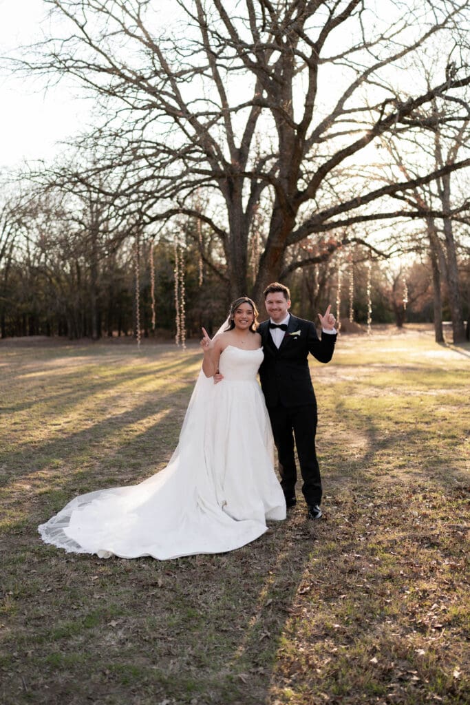 Wedding photography of bride and groom outside with the sun setting behind them in Decatur, TX