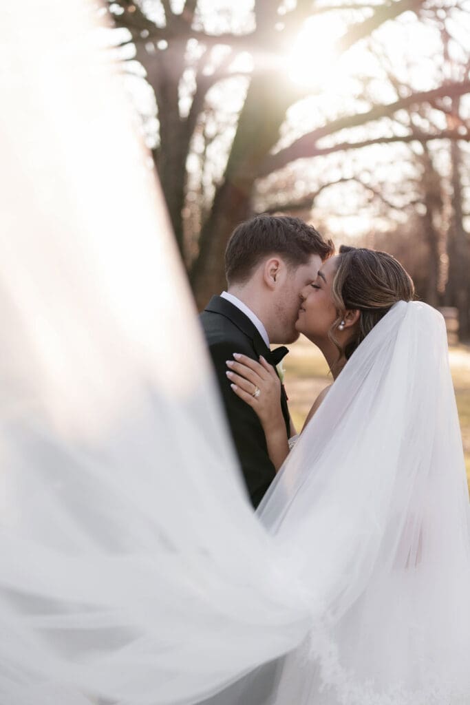 Wedding photography of bride and groom outside with the sun setting behind them in Decatur, TX