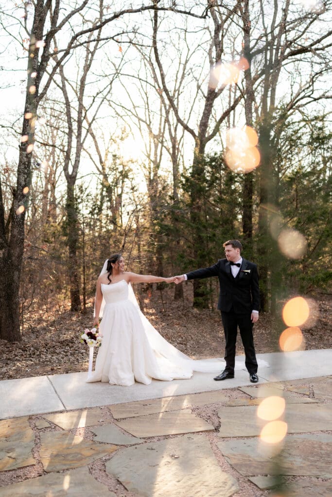 Bride and groom walking along the pathway outside at Soli Deo Gloria in Decatur