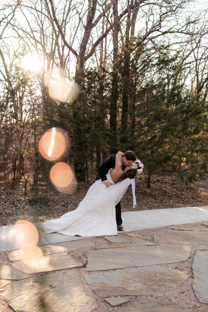 Bride and groom walking along the pathway outside at Soli Deo Gloria in Decatur
